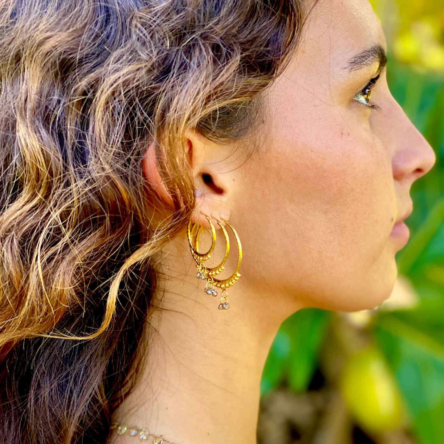 Hand-Hammered Golden Droplet Hoops with Dark Diamonds