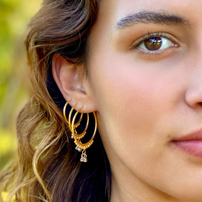 Hand-Hammered Golden Droplet Hoops with Dark Diamonds